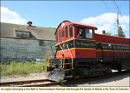 An engin belonging to the Bath &&nbsp;Hammondsport Railroad rolls through the hamlet of Atlanta in the Town of Cohocton, New York.