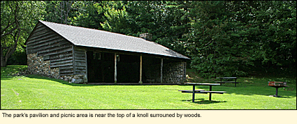 The Harriet Hollister Spencer Memorial Recreation Area's pavilion and picnic area is near the top of a knoll surrounded by woods.