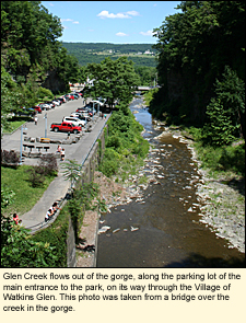 Glen Creek in Watkins Glen State Park flows out of the gorge, along the parking lot of the main entrance to the park, on its way through the Village of Watkins Glen. This photo was taken from a bridge over the creek in the gorge.