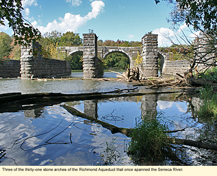 Three of the thirty-one stone arches of the Richmond Aqueduct that once spanned the Seneca River.