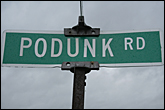 Podunk road sign in the Town of Ulysses in the Finger Lakes Region of New York State.
