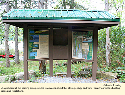A sign board at Hemlock Lake's parking area provides information about the lake's geolgy and water quality as well as boating rules and regulations.