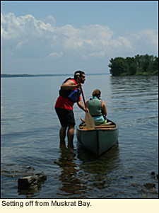 Canoers set of from Muskrat Bay on Oneida Lake in the Finger Lakes, New York USA.