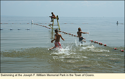 Kids swminning at the Joseph F. William Memorial Park along Oneida Lake in the Finger Lakes, New York USA.