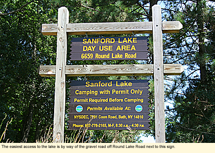 The easiest access the Sanford Lake in Steuben County, New York is by way of the gravel road off Round Lake Road next to this sign. Sgn says: Sanford Lake Day Use Area
