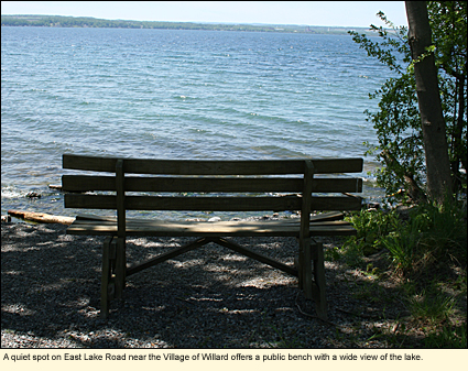 A quiet spot on East Lake Road near the Village of Willard offers a shady public bench with a wide view of the Seneca Lake, in the Finger Lakes, New York, USA.