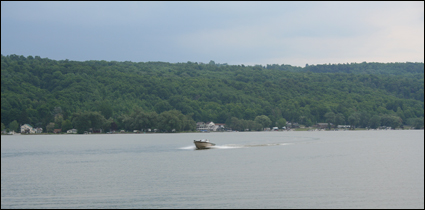 Motorboating on Otisco Lake in the Finger Lakes, New York USA.