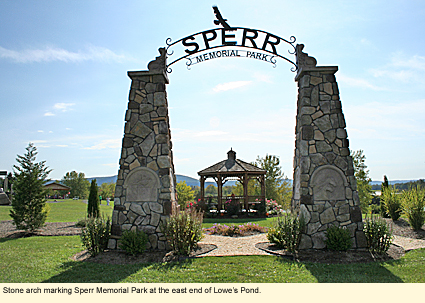 Stone arch marking Sperr Memorial Park at the east end of Lowe's Pond.