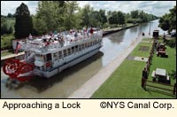 A tour boat on the Erie Canal approaches a lock near Rochester, New York in the Finger Lakes.