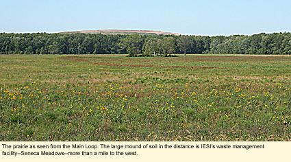 The prairie as seen from the Main Loop. The large mound of soil in the distance id IESI's waste management facility--Seneca Meadows--more than a mile to the west.