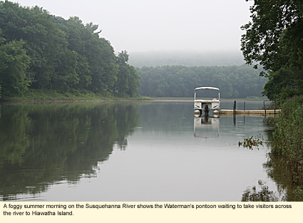 A foggy summer morning on the Susquehanna River shows the Waterman's pontoon waiting to take visitors across the river to Hiawatha Island.
