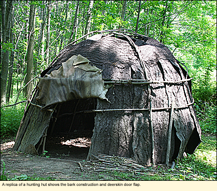 A replica of a hunting hut shows the bark construction and deerskin door flap at Ganondagan State Historic Site.