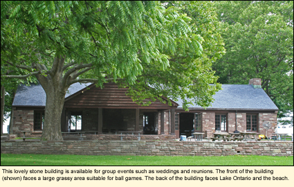 This lovely stone building is available for group events such as weddings and reunions. The front of the building (shown) faces a large grassy area suitable for ball games. The back of the building faces Lake Ontario and the beach.