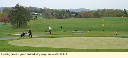 A putting practice green and a driving range are next to Hole 1.