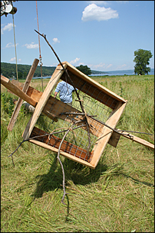 Photo 8-Sticks are tied in the nest box to give the ospreys a hint as to what to do. Credit: Ronda Roaring