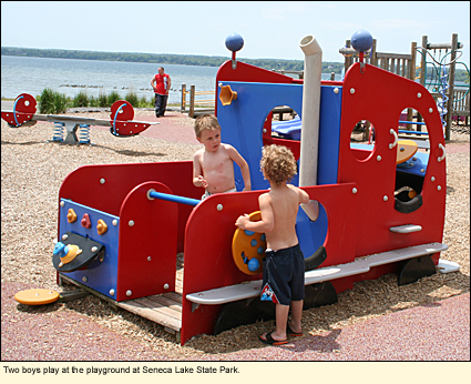 Two boys play at the playground at Seneca Lake State Park.