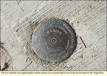 This is a relatively new gaging station marker placed in a concrete stair at one of the launch sites for the Tioga River in Steuben County, New York.