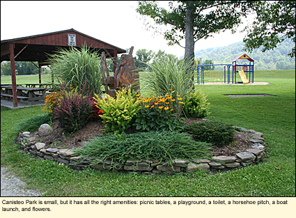Canisteo Park is small, but it has all the right amenities: Picnic tables, a playground, a toilet, a horseshoe pitch, a boat launch, and flowers.