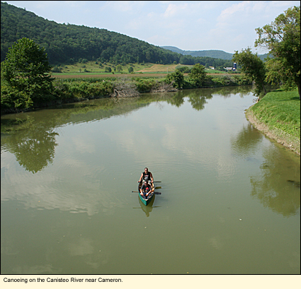 Canoeing on the Canisteo River near Cameron in the Finger Lakes, New York.